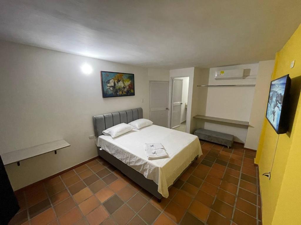Postel nebo postele na pokoji v ubytování Hotel Valle Central