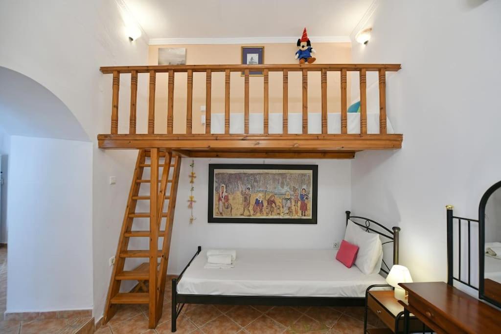 A bed or beds in a room at Maria's House