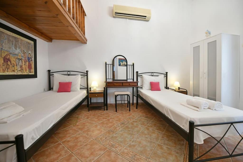 A bed or beds in a room at Maria's House