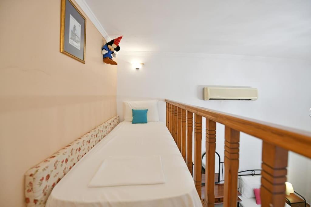 A bed or beds in a room at Maria's House