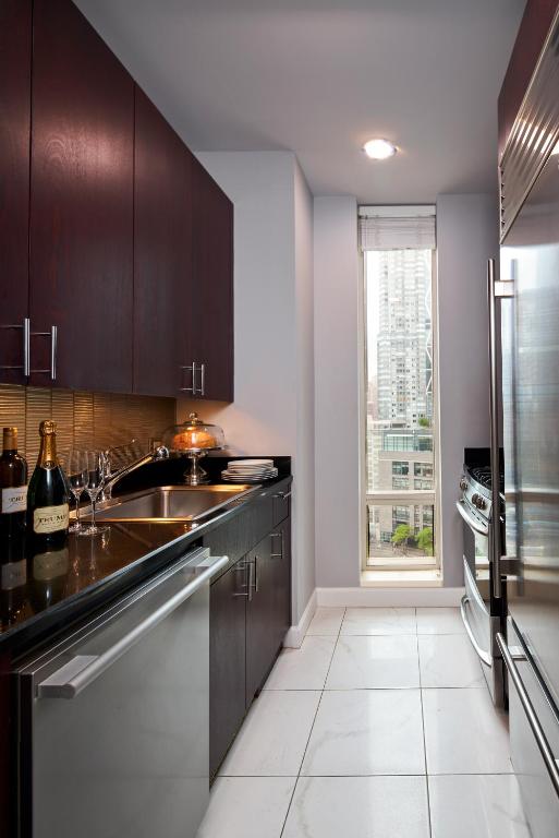 a kitchen with a sink and a refrigerator at Trump International New York in New York