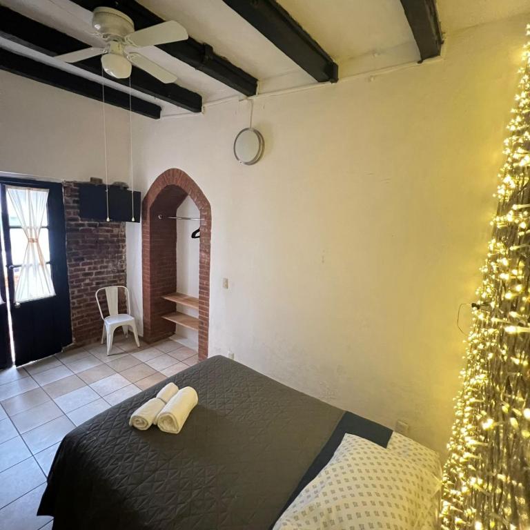 Postel nebo postele na pokoji v ubytování Hostal Luna 49