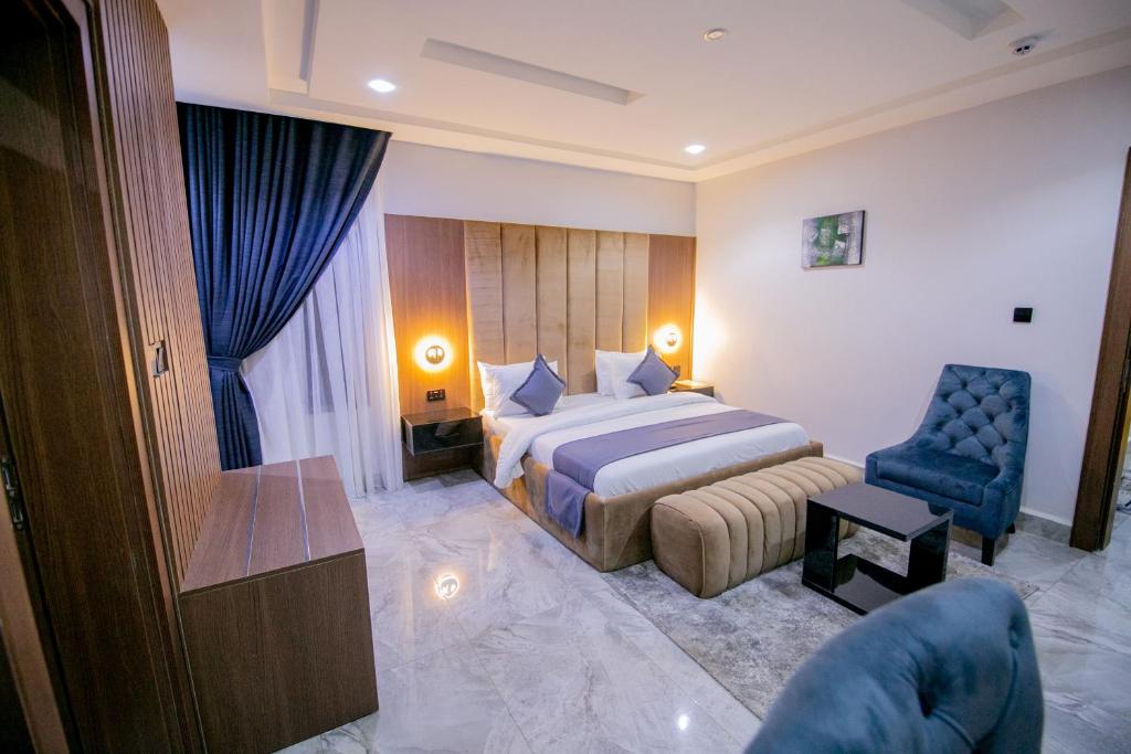 Postel nebo postele na pokoji v ubytování Tranquila Hotels and Suites Abuja