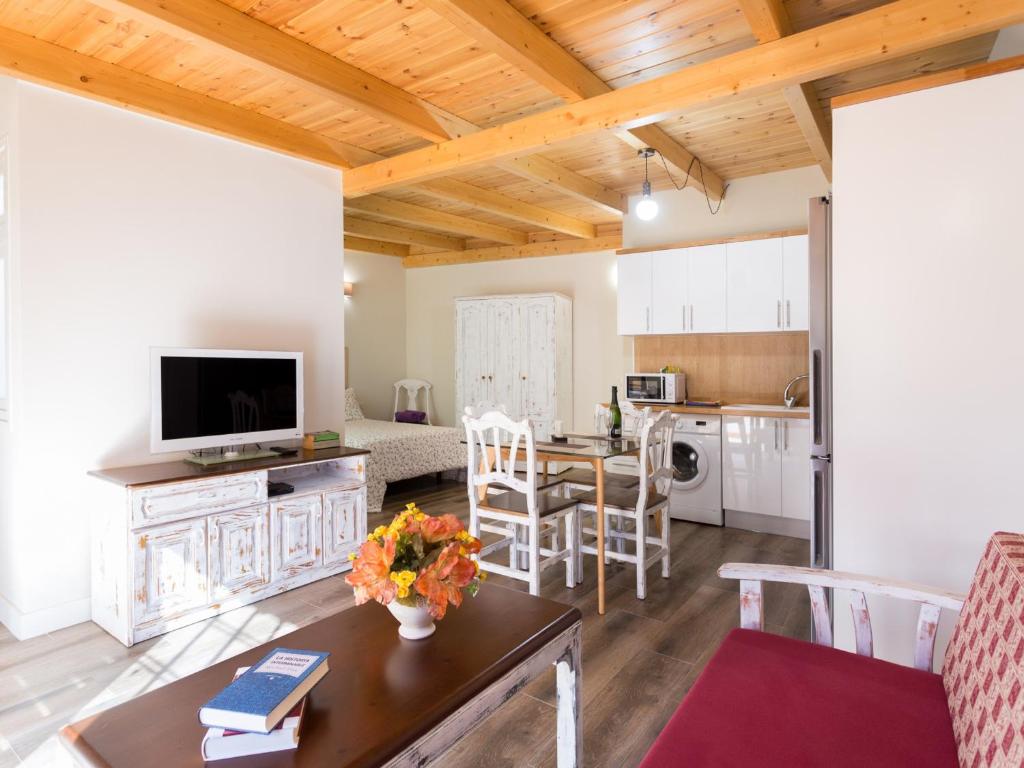 a living room with a table and a kitchen at Apartamento La Caleta de Interián, 1 dormitorio, 2 personas - ES-279-5 in Garachico