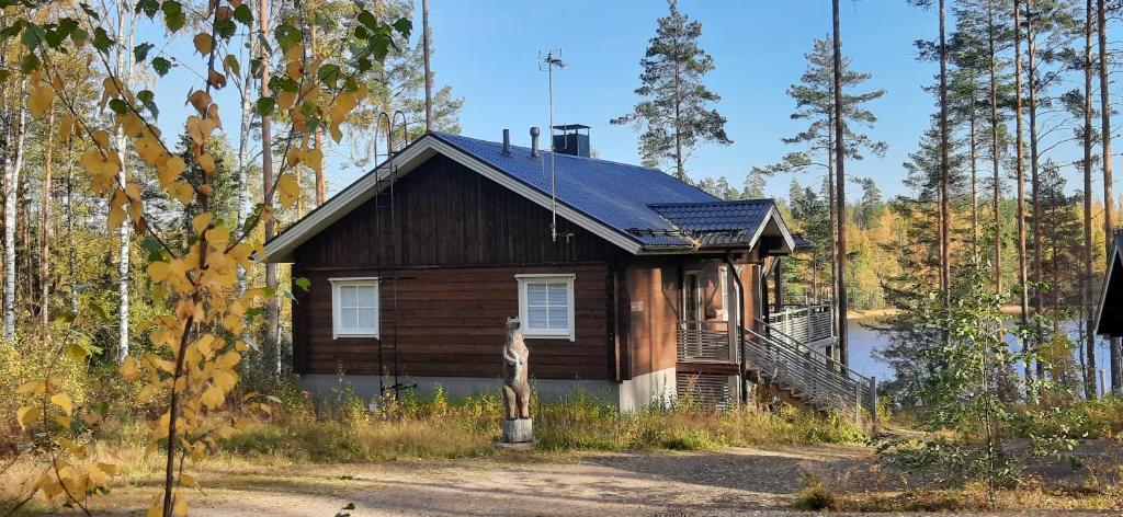 a small wooden house in the middle of a forest at Villa Hapero in Mikkeli