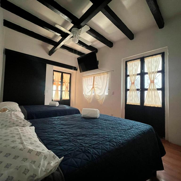 Postel nebo postele na pokoji v ubytování Hostal Luna 49