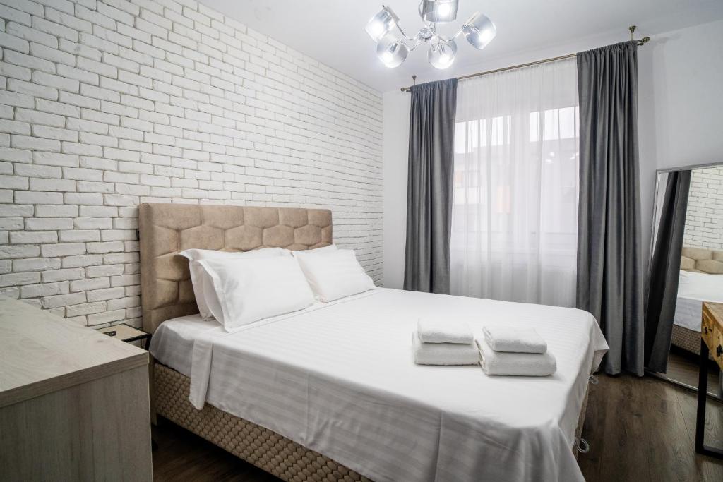 ApartBnb Green Vibe 32 tesisinde bir odada yatak veya yataklar
