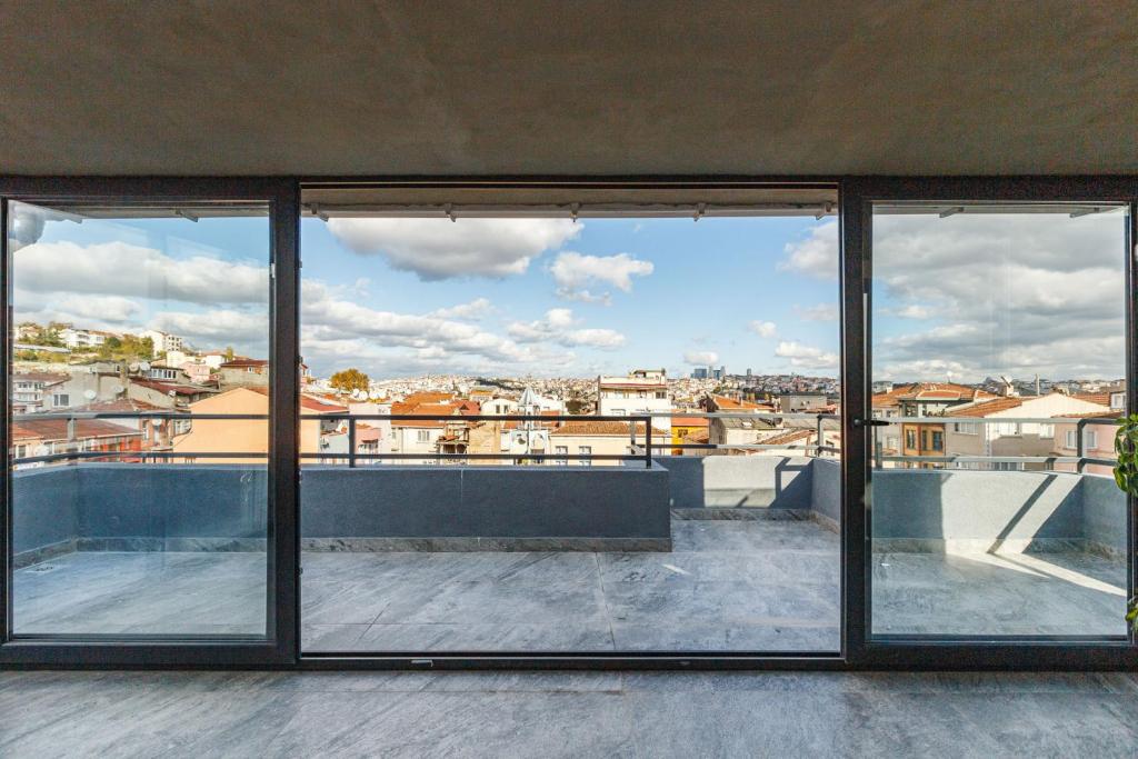 a view of a city from a building with windows at Cozy in Istanbul