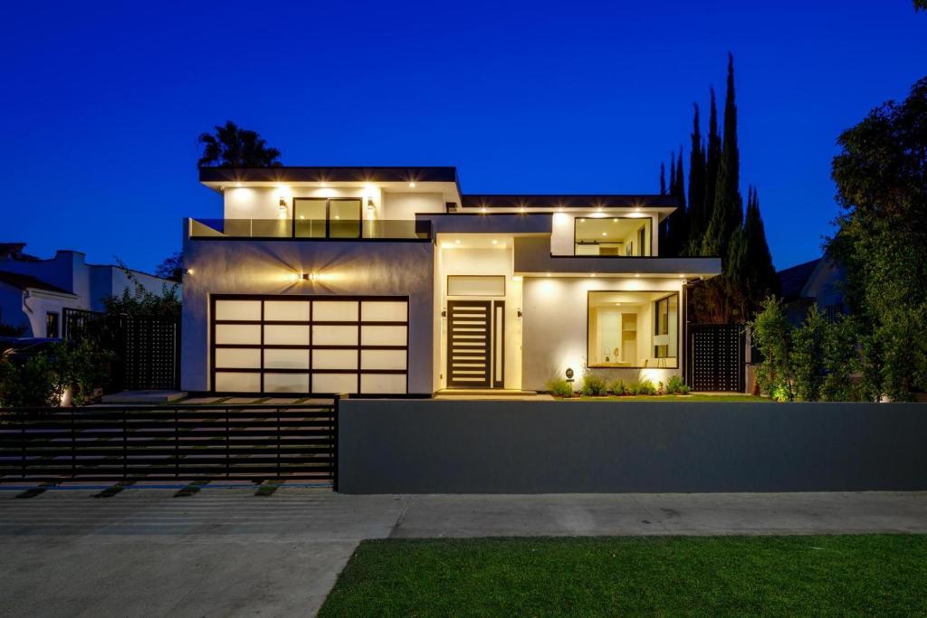 a house with lights on it at night at Curson Modern in Los Angeles