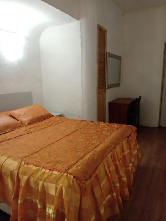 Postel nebo postele na pokoji v ubytování Hotel Capric