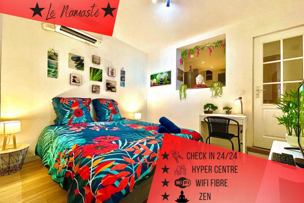 a bedroom with a bed and a sign in front of it at *Le Namasté*Fibre Wifi*Hyper Centre* in Salon-de-Provence