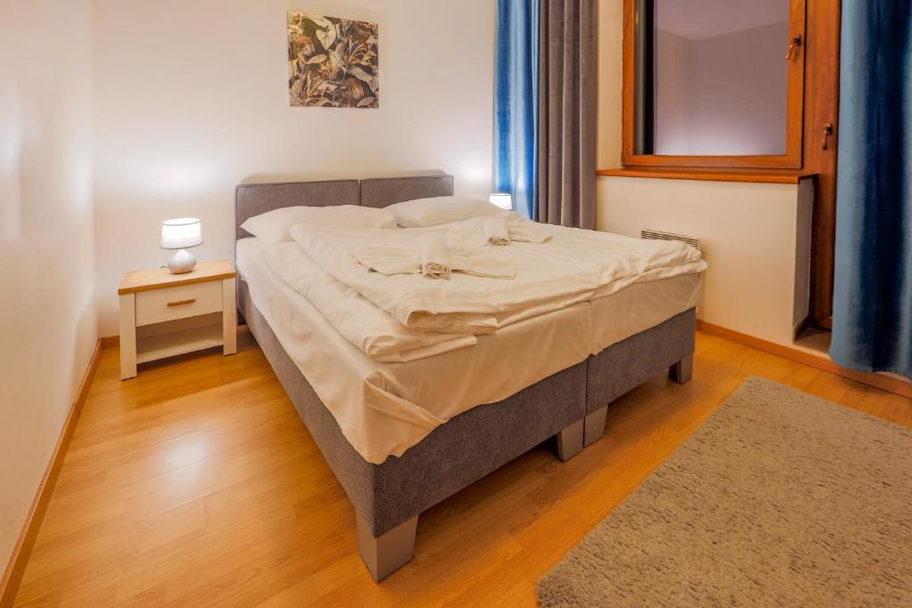 Postel nebo postele na pokoji v ubytování Apartmánový dom Fatrapark 1 s Wellness - Hlavná recepcia