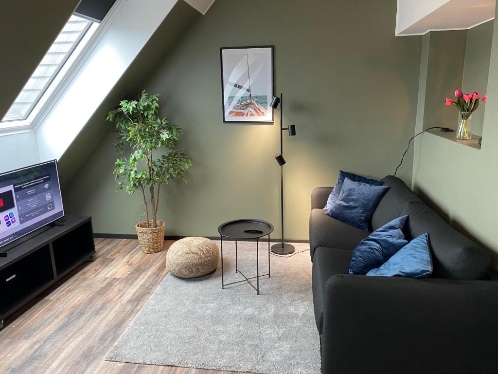 TV a/nebo společenská místnost v ubytování Magnolia House Sollentuna