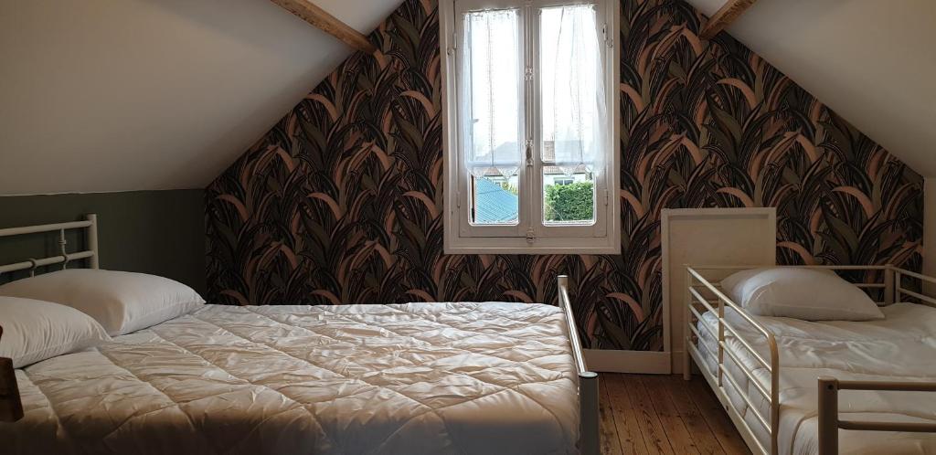 Postel nebo postele na pokoji v ubytování Chez fabienne