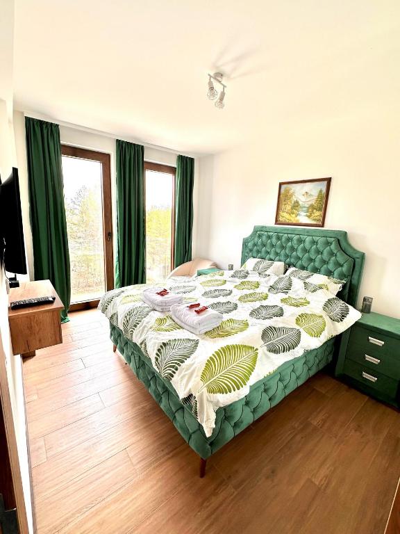 Postel nebo postele na pokoji v ubytování Lexi Borovi apartman