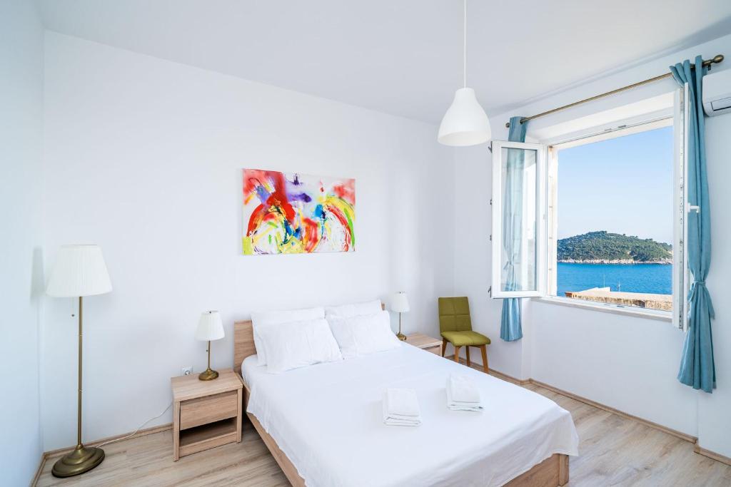 Posteľ alebo postele v izbe v ubytovaní Dubrovnik SEA VIEW MAGNOLIA APARTMENTS