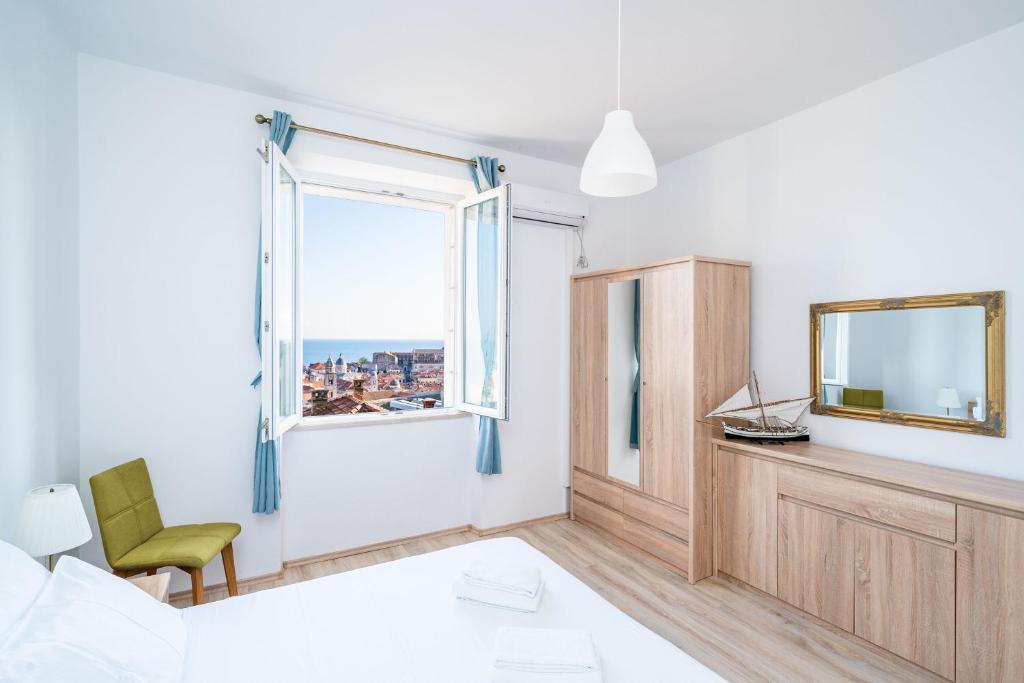 Posteľ alebo postele v izbe v ubytovaní Dubrovnik SEA VIEW MAGNOLIA APARTMENTS