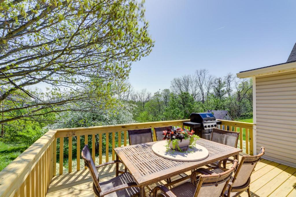 a wooden deck with a table and chairs and a grill at Williamstown Vacation Rental Private Deck and Yard in Williamstown