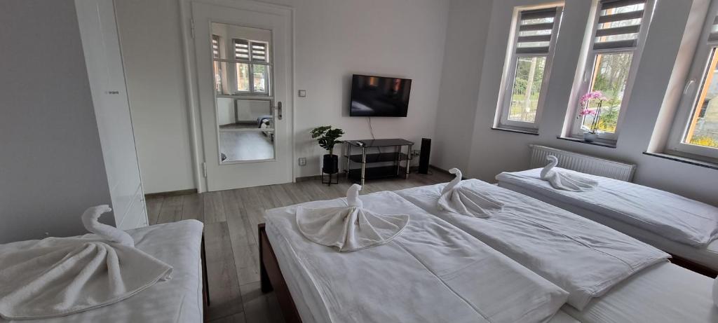 Postel nebo postele na pokoji v ubytování Vila Věrka