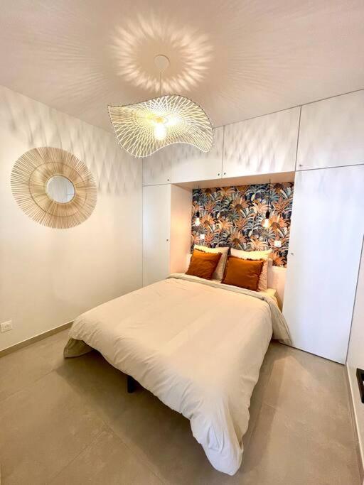 Posteľ alebo postele v izbe v ubytovaní Appartement moderne + Parking à 50m de la mer
