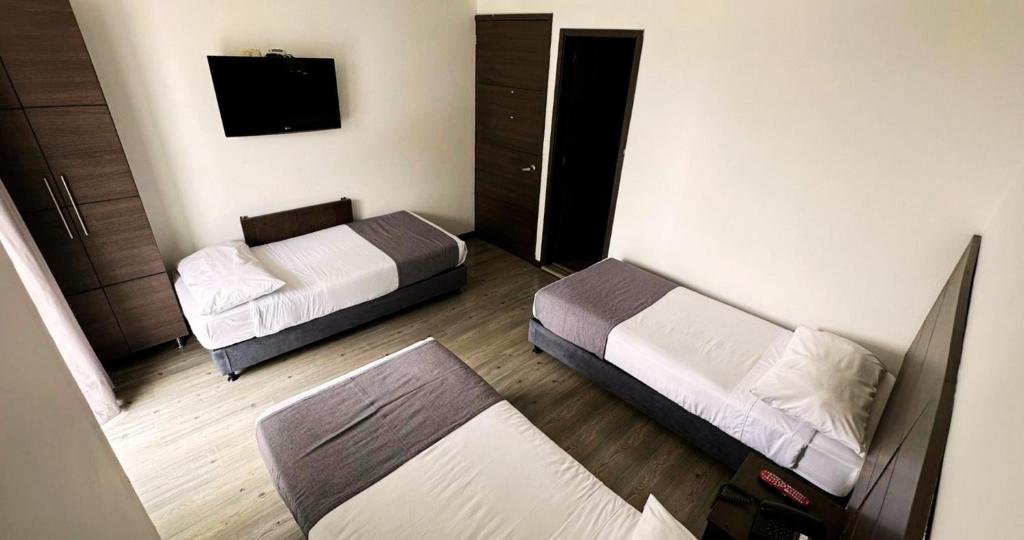 Postel nebo postele na pokoji v ubytování Hotel Expo Hotel Ferial