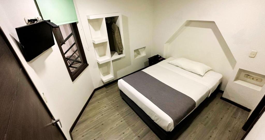 Postel nebo postele na pokoji v ubytování Hotel Expo Hotel Ferial