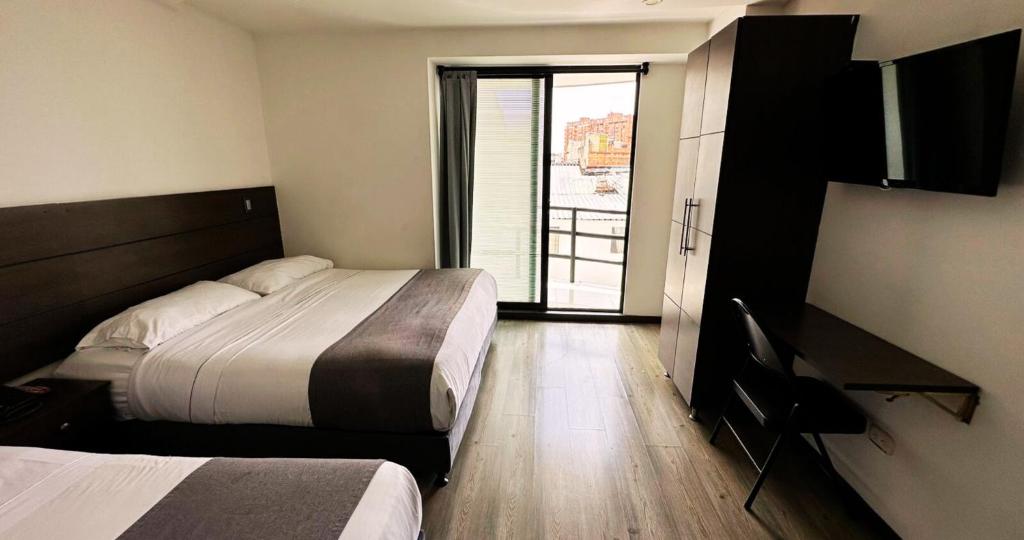 Postel nebo postele na pokoji v ubytování Hotel Expo Hotel Ferial