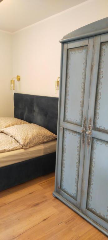 Postel nebo postele na pokoji v ubytování Apartamenty Heweliusz House