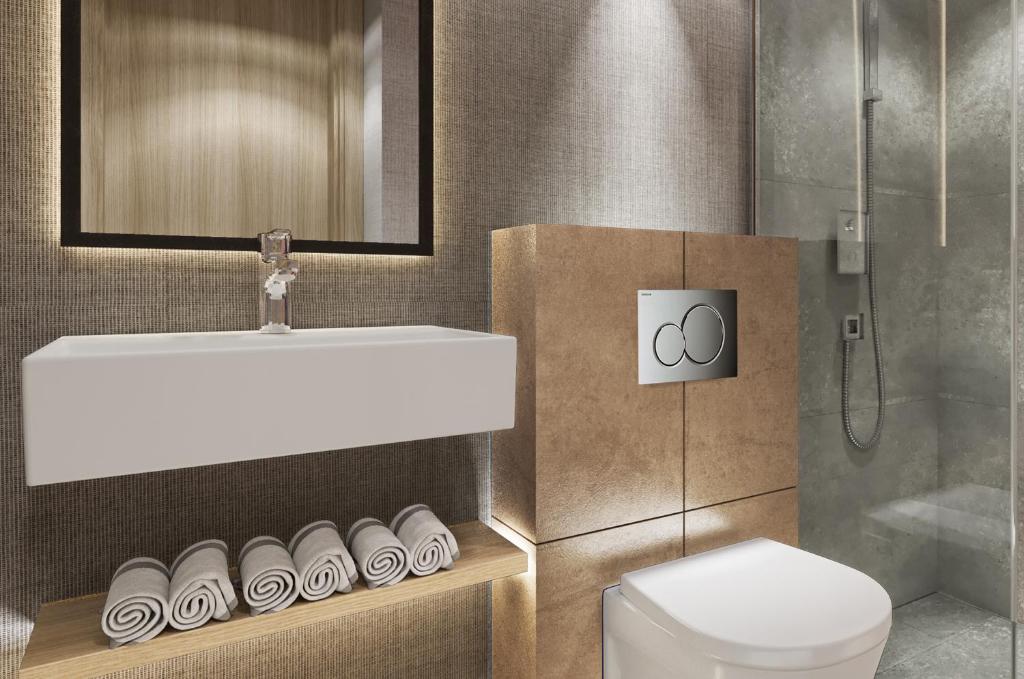 a bathroom with a sink and a toilet at Erzurumlu Hotel in Kilyos