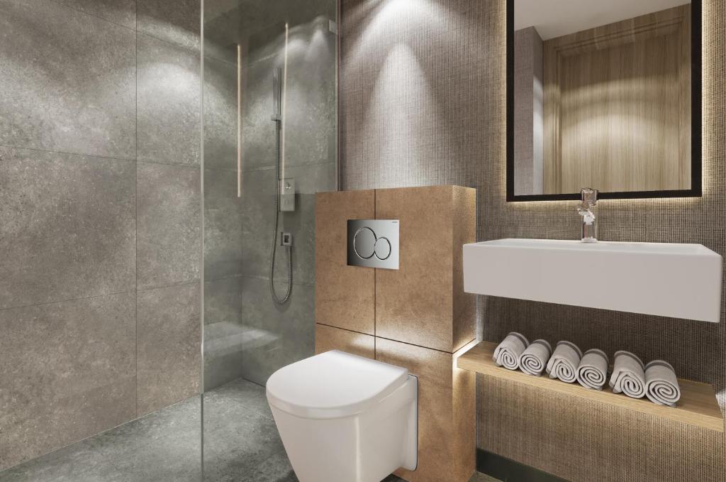 a bathroom with a toilet and a sink and a shower at Erzurumlu Hotel in Kilyos