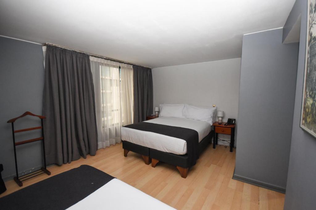 Postel nebo postele na pokoji v ubytování Tempo Rent Apart Hotel