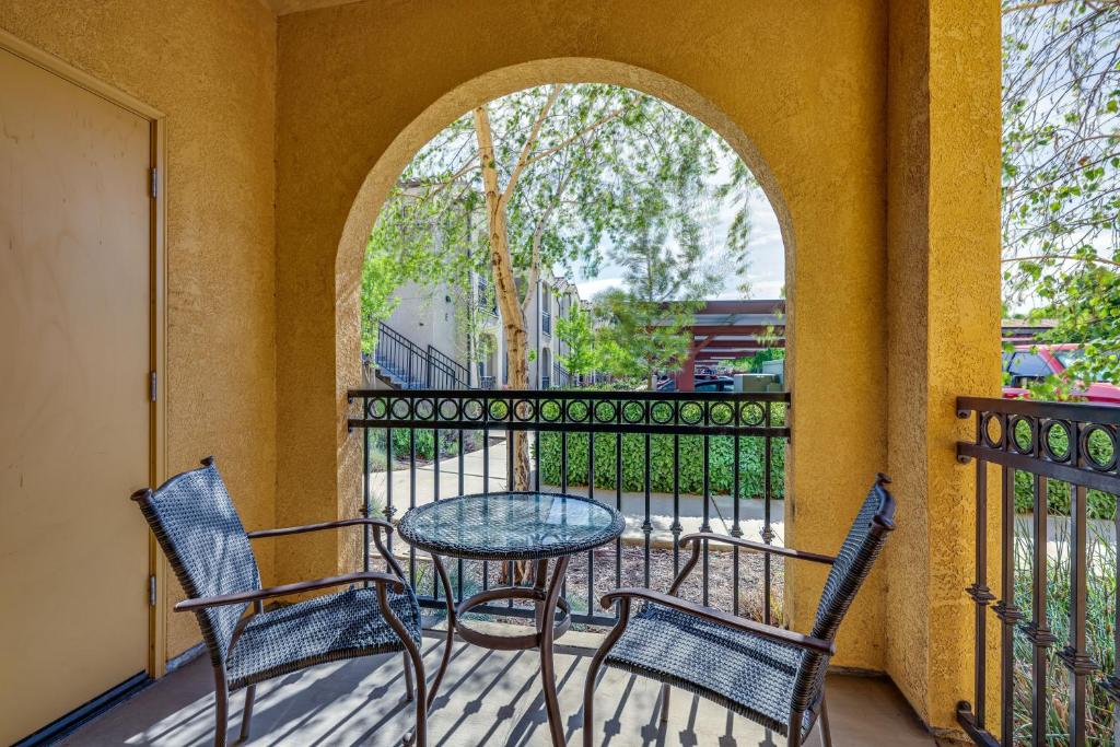 a patio with a table and chairs on a balcony at Charming Patterson Condo with Grilling Stations in Patterson