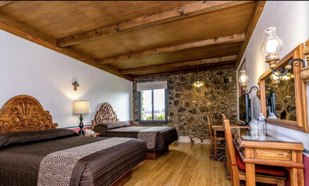 Postel nebo postele na pokoji v ubytování Posada de la Aldea