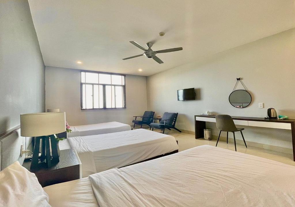 Voodi või voodid majutusasutuse My Khe 2 Da Nang Seafront Hotel toas