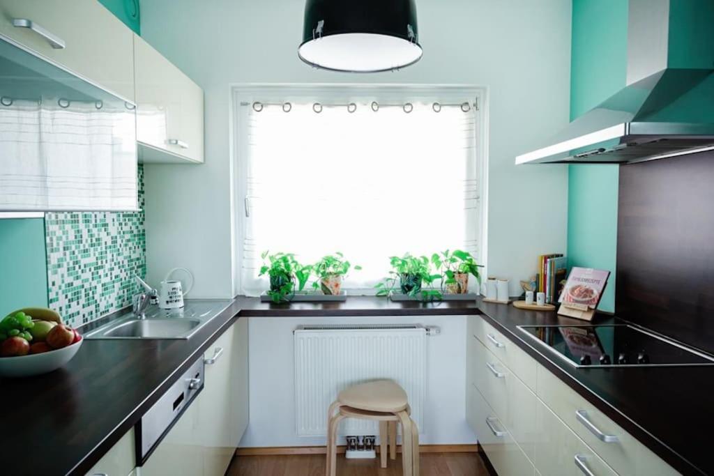 Kuchyň nebo kuchyňský kout v ubytování Boho-Chic-Wohnung Neusiedl