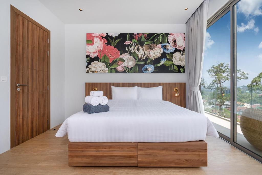 Postel nebo postele na pokoji v ubytování Himmapana Villas - Hills