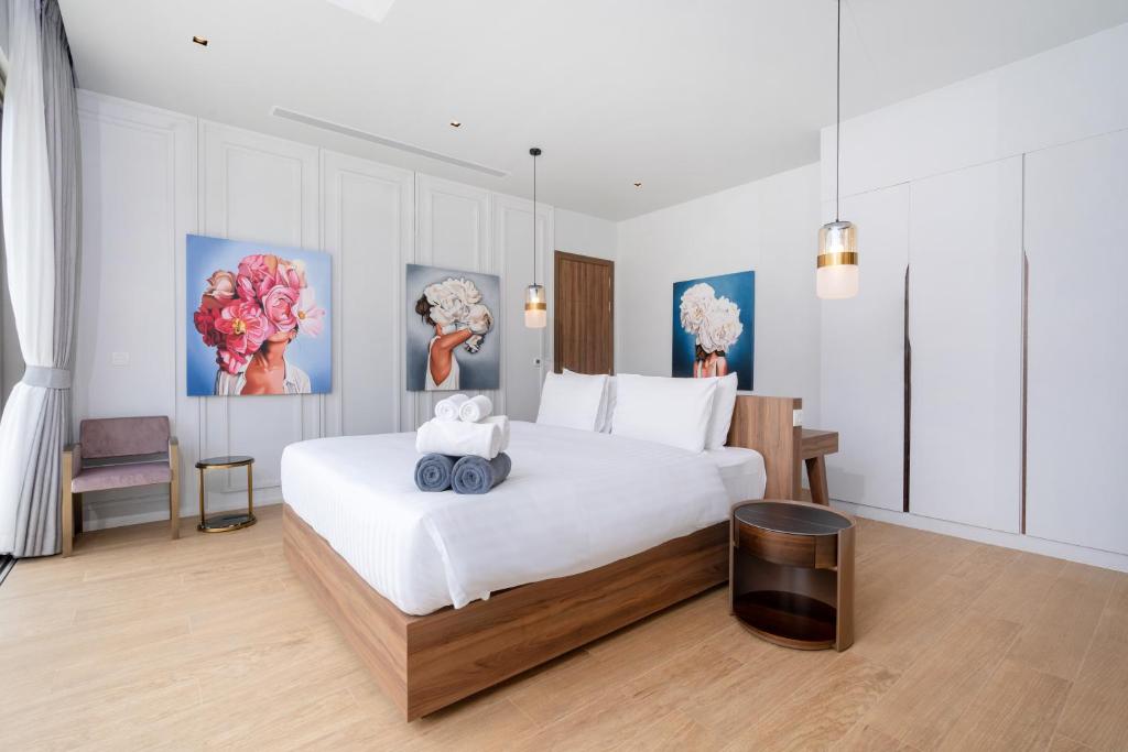 Postel nebo postele na pokoji v ubytování Himmapana Villas - Hills