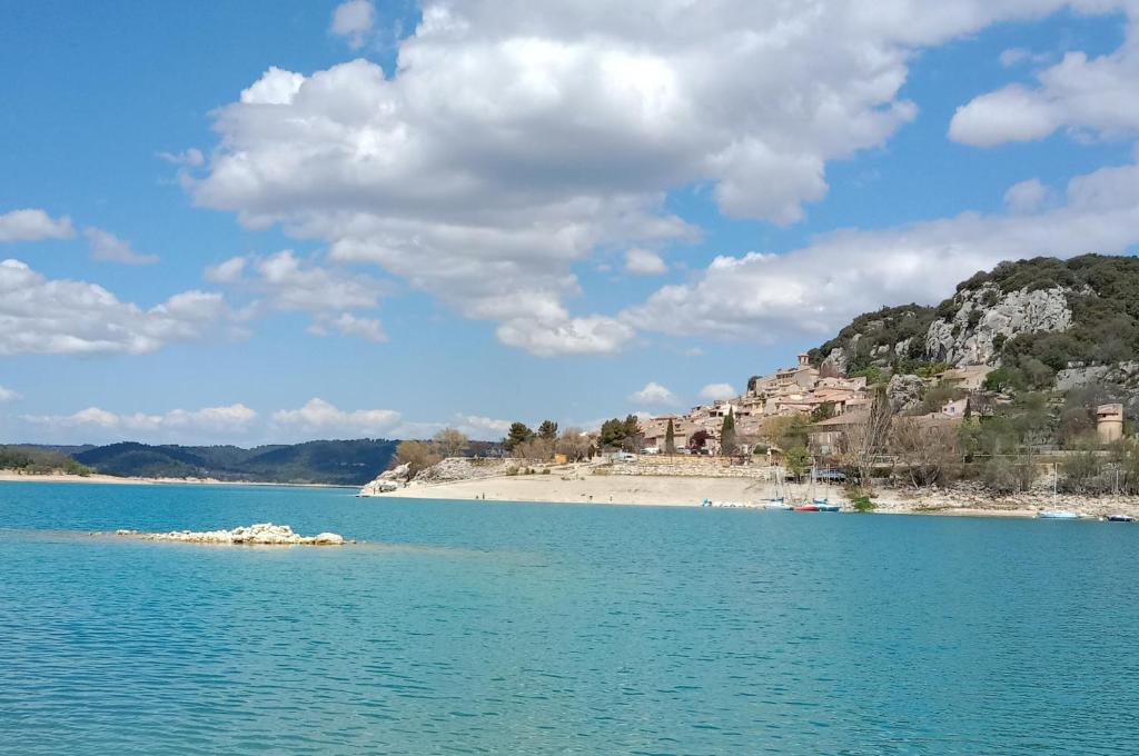 a view of a body of water with a beach at Villa Castellane in Bauduen