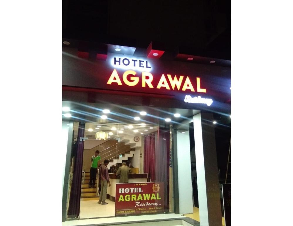 a hotel agrawal sign in front of a store at Hotel Agrawal, Pachmarhi in Pachmarhī