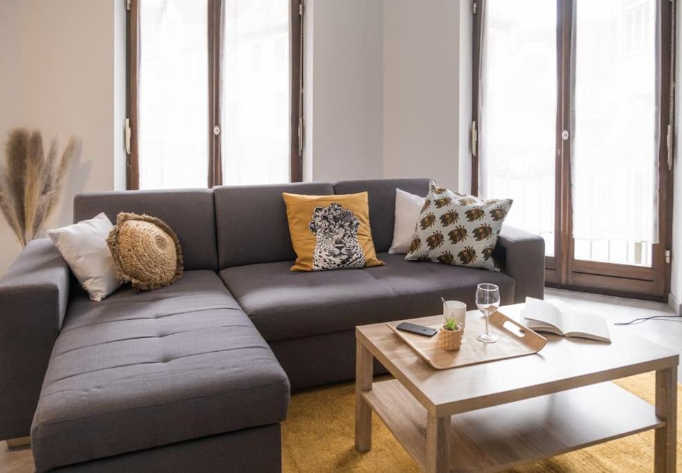 a living room with a couch and a coffee table at Nouveau - Le Luminosa - Centre ville in Haguenau