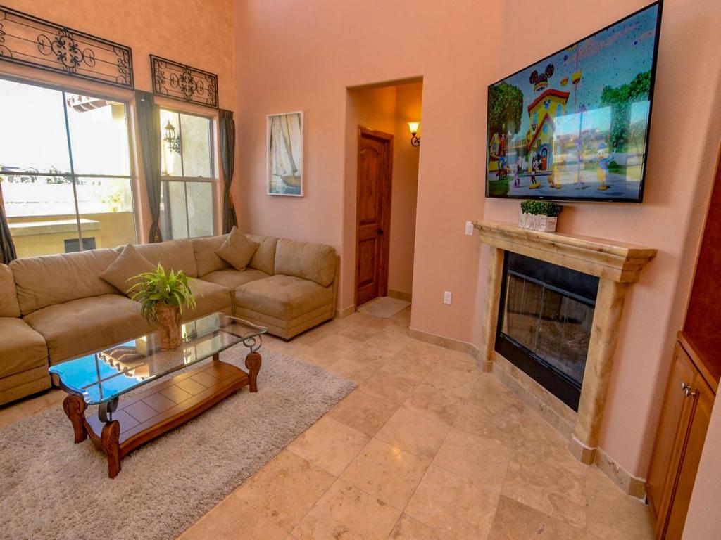 a living room with a couch and a fireplace at Condo 31-1 Right in front of the Pool with WiFi in San Felipe