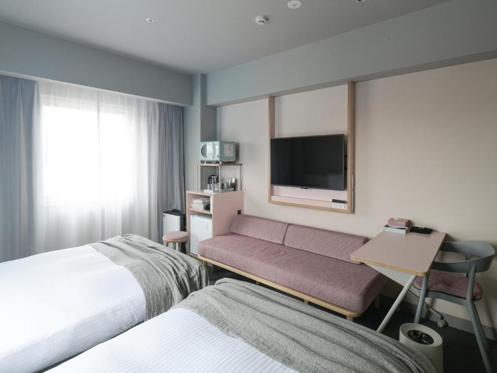 Postel nebo postele na pokoji v ubytování Vessel Inn Takadanobaba Station