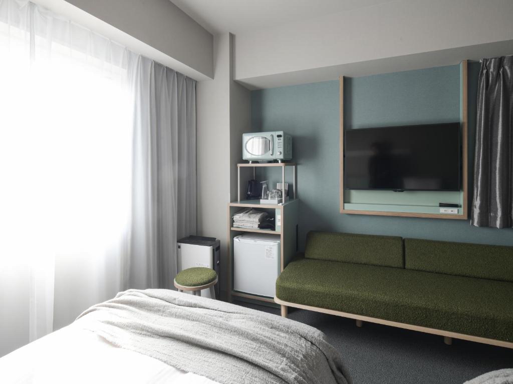 Postel nebo postele na pokoji v ubytování Vessel Inn Takadanobaba Station