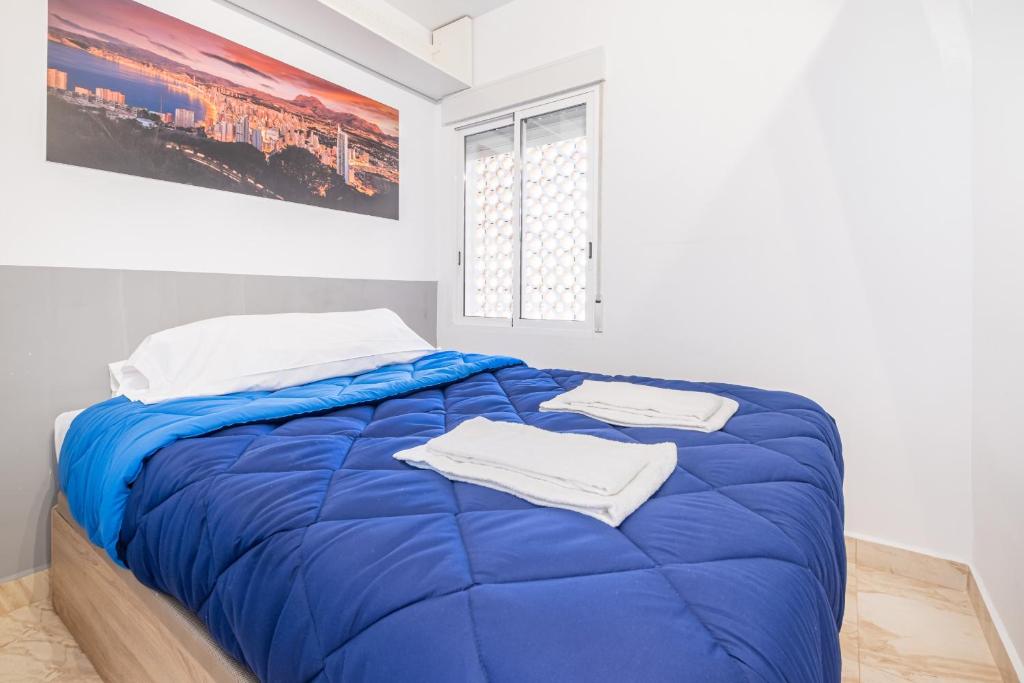 Łóżko lub łóżka w pokoju w obiekcie Acuarium II 5-B Apartment Levante Beach