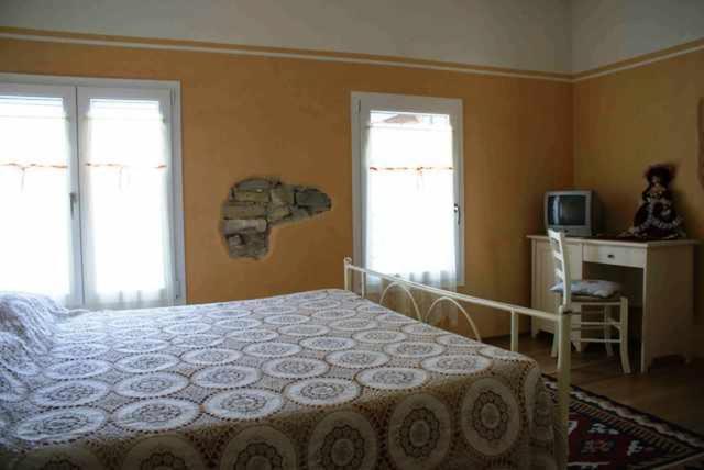 Posteľ alebo postele v izbe v ubytovaní Agriturismo Antiche Mura