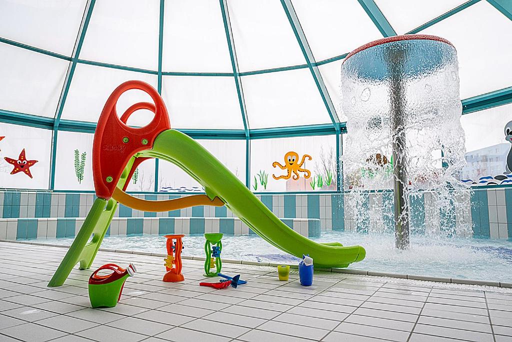 a water park with a slide and a fountain at Hotel reSTART Superior in Jičín
