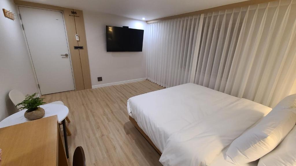 Postel nebo postele na pokoji v ubytování Hotel Andrest