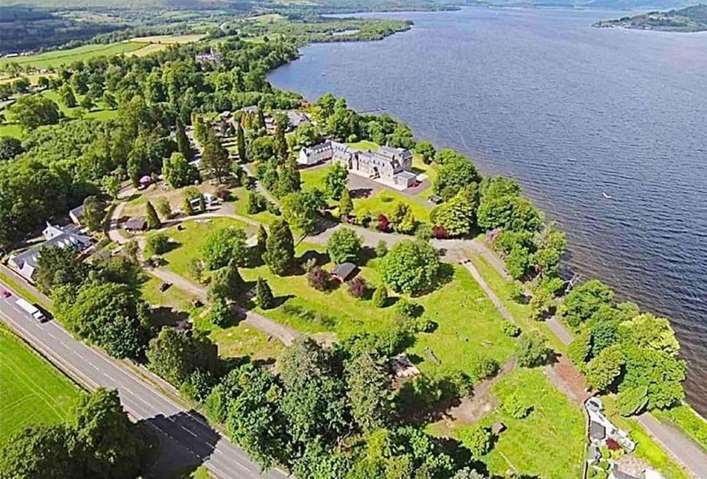 an aerial view of an island in a body of water at Lomond View in Luss