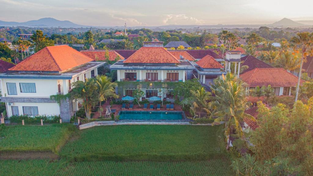 an aerial view of a large house with red roofs at Artini Bisma Ubud Hotel in Ubud