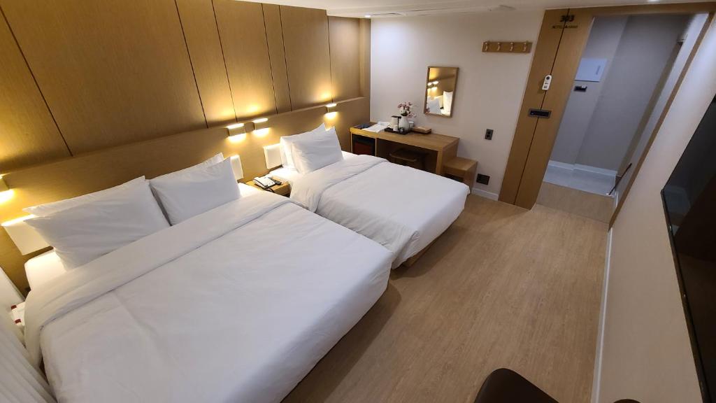 Postel nebo postele na pokoji v ubytování Hotel Andrest